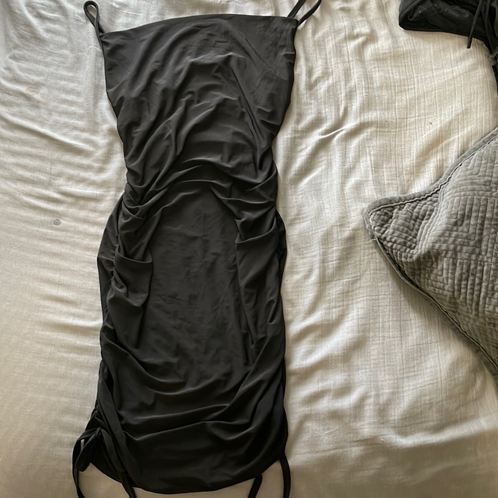 Black dress with scrunch sides and low hanging top in size small and black